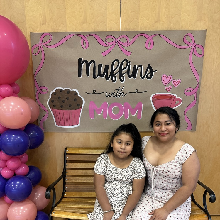 mother and daughter posing