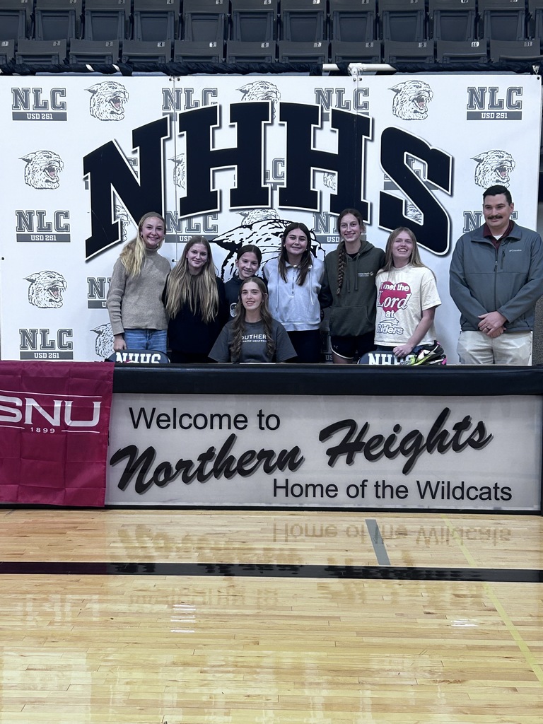 Laura Cathcart, with her Cross Country team and coach, celebrating a special moment.