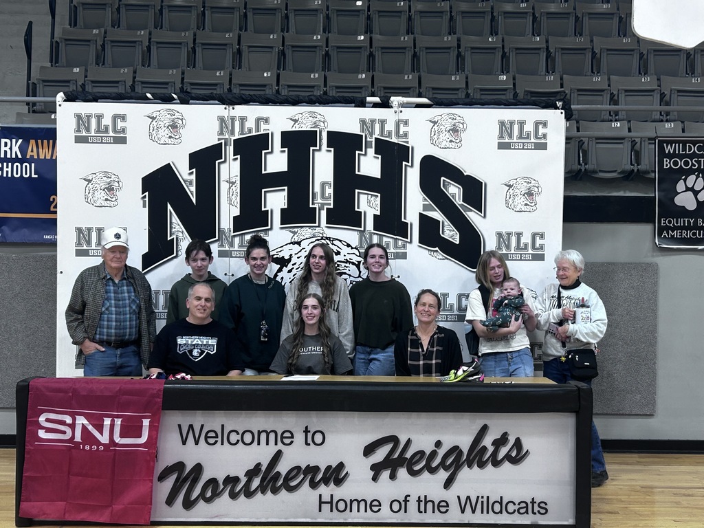 Laura Cathcart, with her family, celebrating her commitment to SNU.