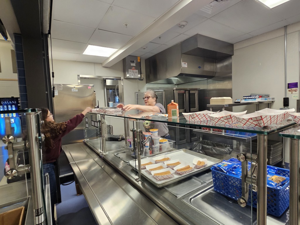 Kitchen staff serving breakfast