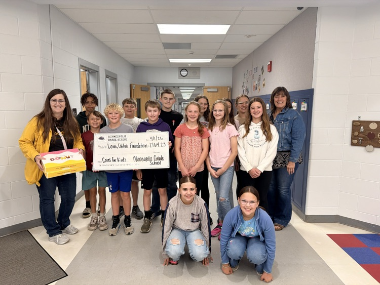The winning class receiving donuts from Heidi Feyerherm-Smith (Love, Chloe President/Founder) and Tyrae Sherbert (Office Coordinator )