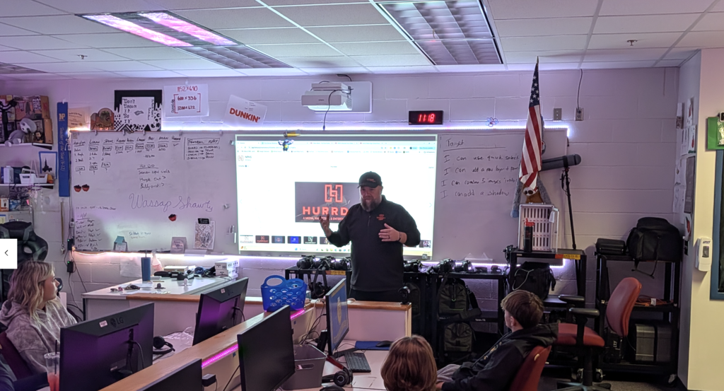 Chris with students in classroom