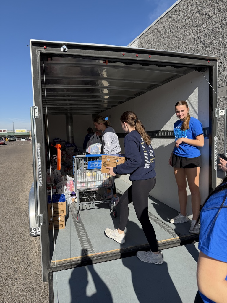NPHS Student Council sorting and loading canned goods for food drive.