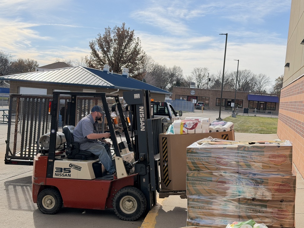 NPPS Custodians and Maintenance helping with canned food drive.