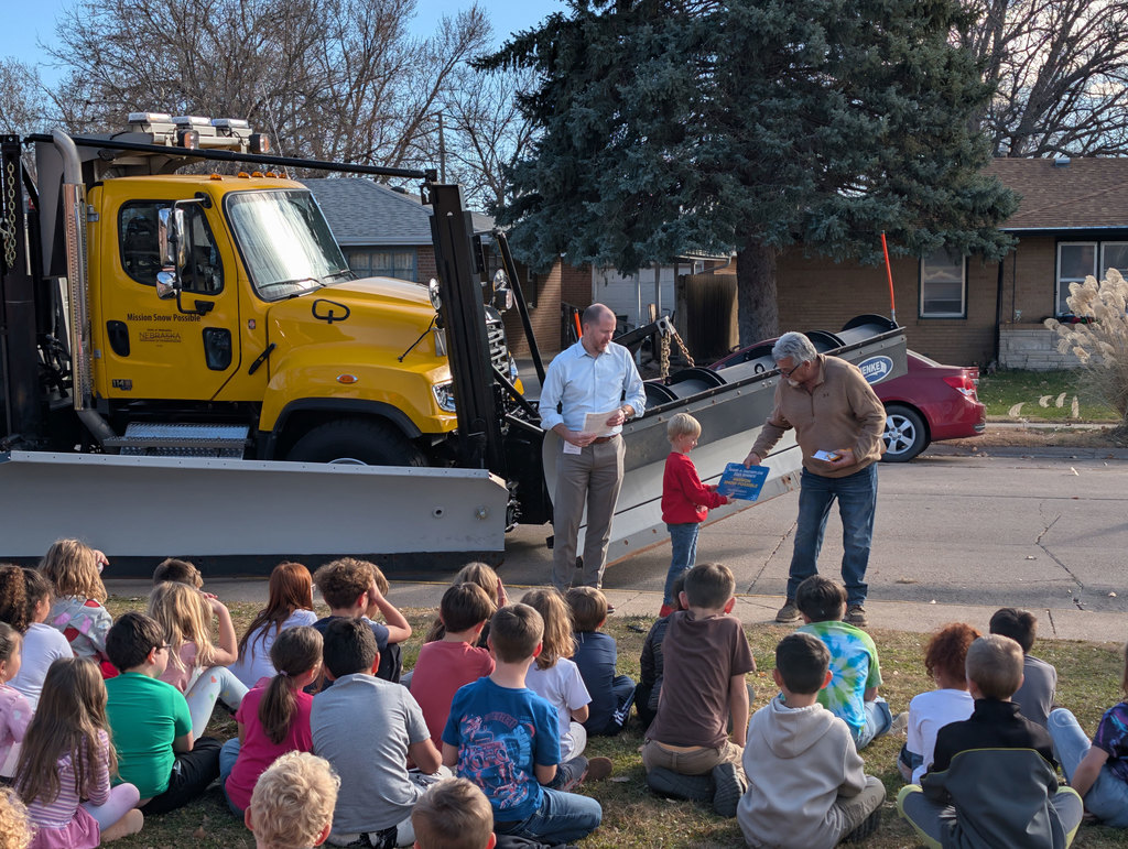 Student recognized for winning name-a-snowplow competition.
