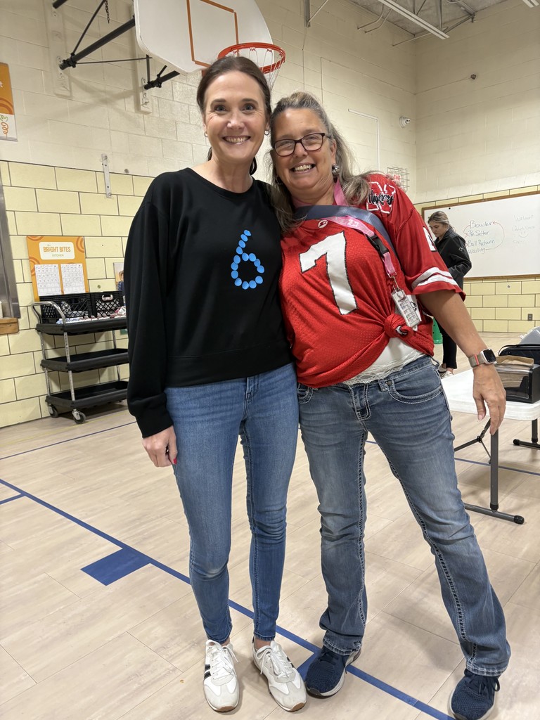 Photo of librarian and para with 6 and 7. 