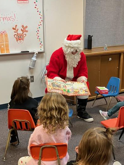 Santa at NPHS reading to kids!
