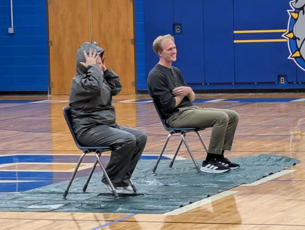 Mrs. Brosius and Mr. Bradley waiting to be pied.