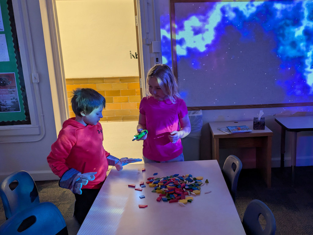 Cody students putting together space puzzle