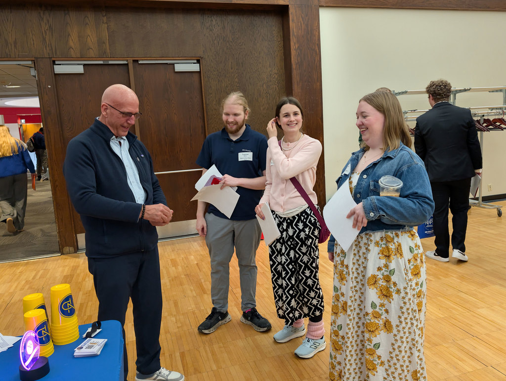 Mr. Mills talking to education majors at UNL Education Career Fair.
