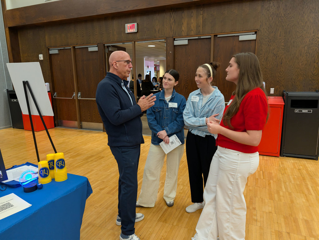 Mr. Mills talking to education majors at UNL Education Career Fair.