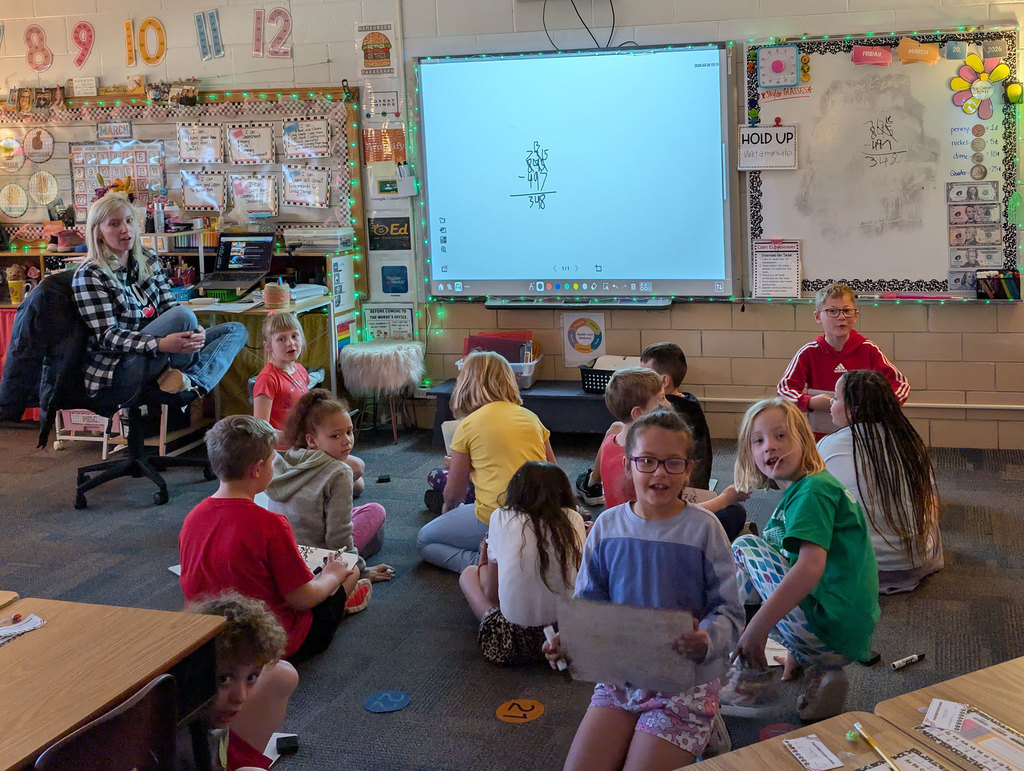 Elementary class working on math problems with an activity.