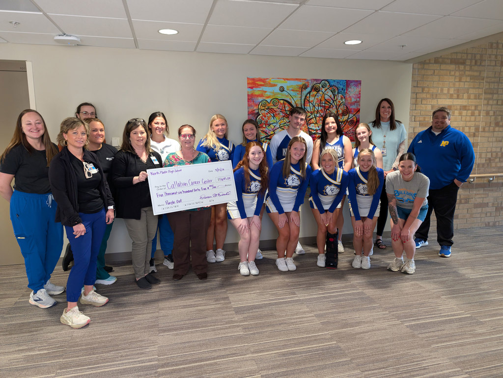 NPHS Cheerleaders and Pacers presenting donation check to the Callahan Cancer Center.