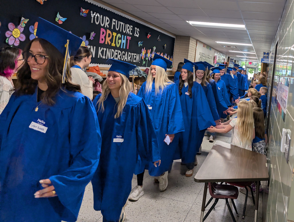 NPHS graduates walking halls of elementary.