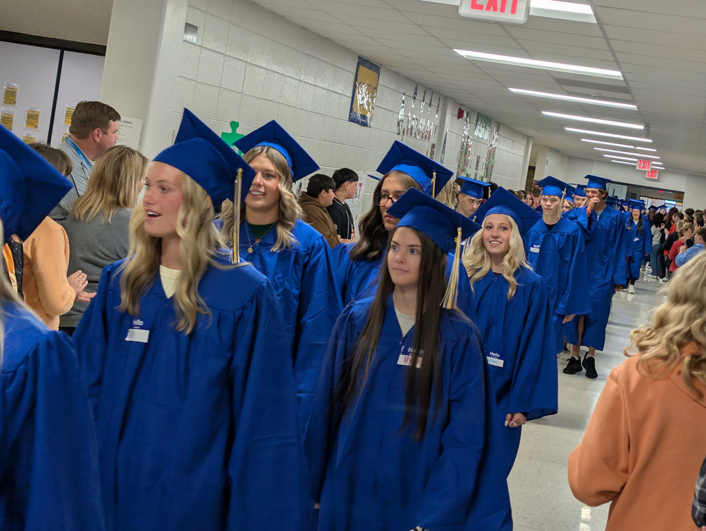 NPHS graduates walking halls of middle school.