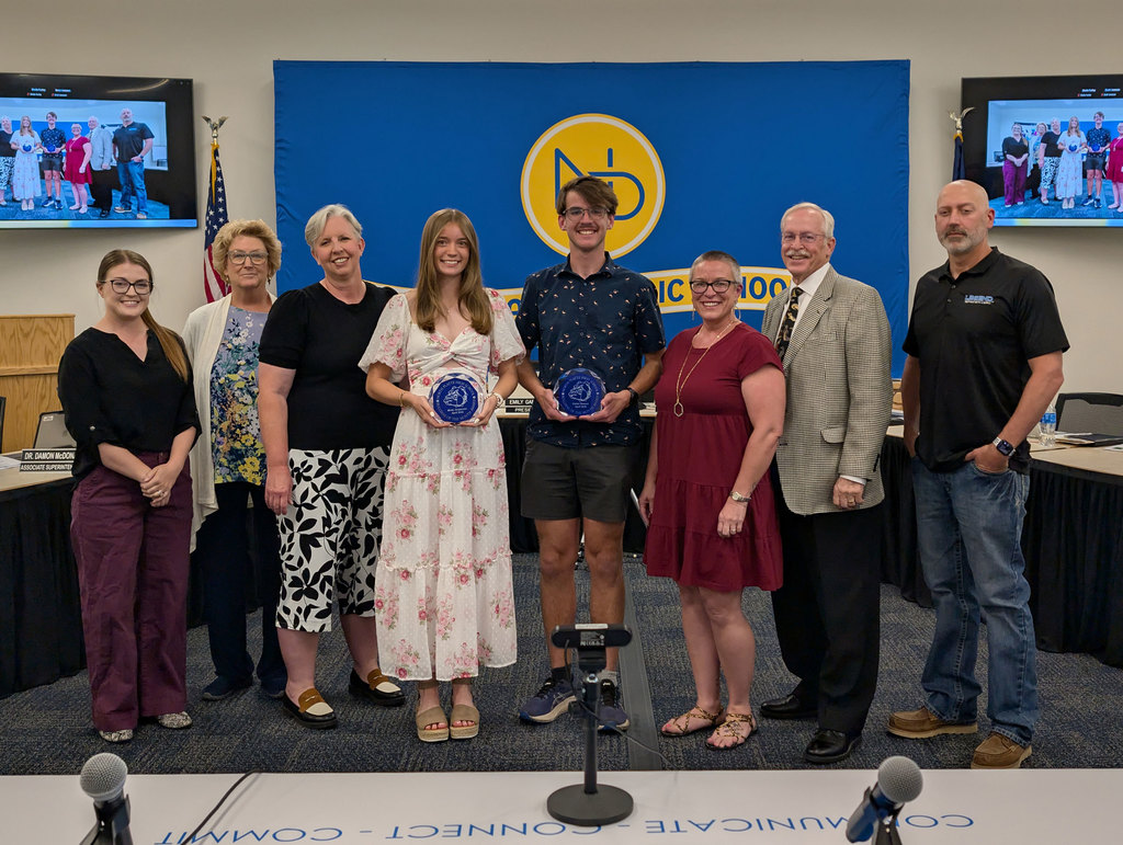 May Bulldogs of the Month Molly Jorgensen and Carter Stewart with the Board of Education