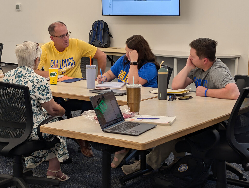 High school administrators working in PLC.