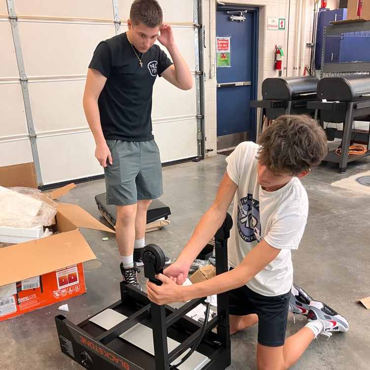 Students assemble Blackstone for Culinary II