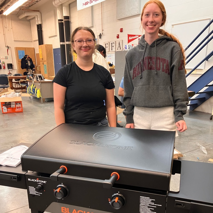 Students show off Blackstone they assembled for Culinary II