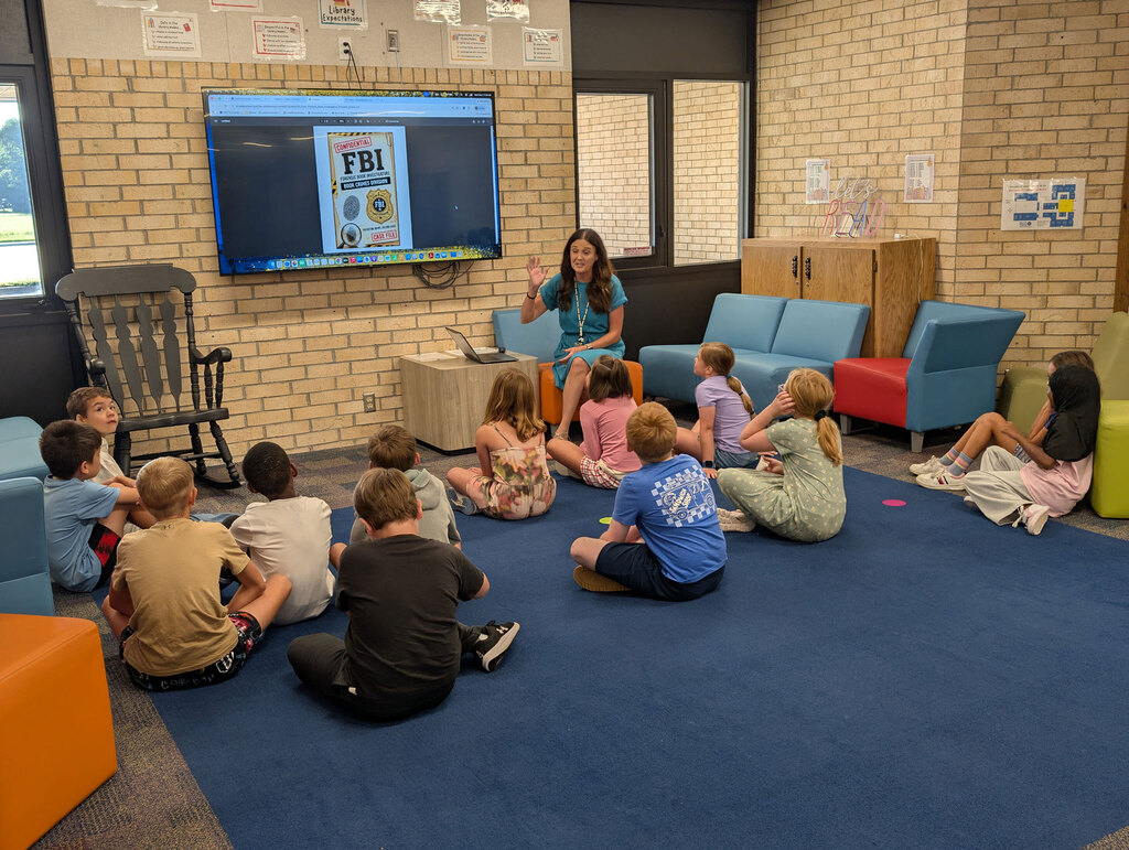 Mrs. Hayes introducing activity to class.