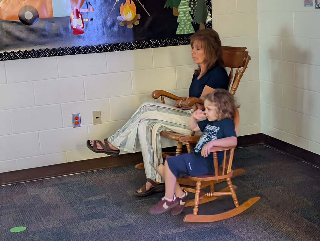 Teacher and student on rocking chairs