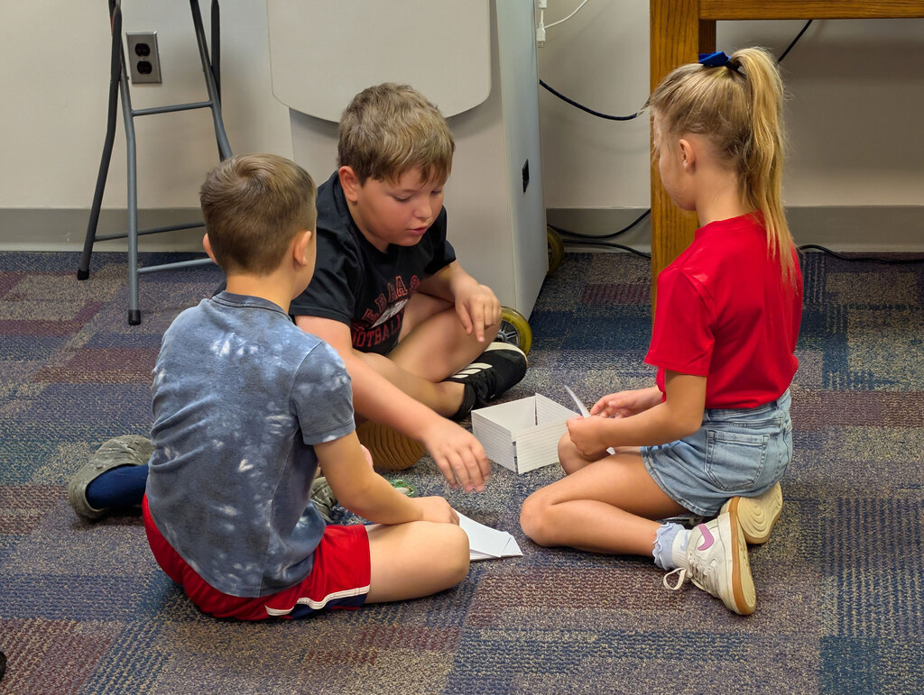 Students working on STEM activity in classroom