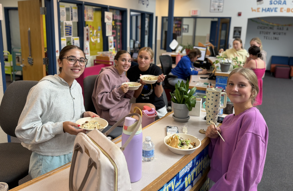 Four 9th VB players posing with their meal