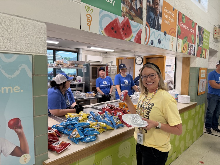 NebraskaLand Bank serving food for our Bingo for Books night. 