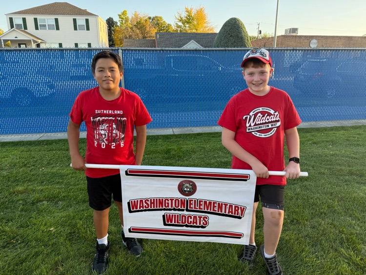 5th Graders carrying Washington banner