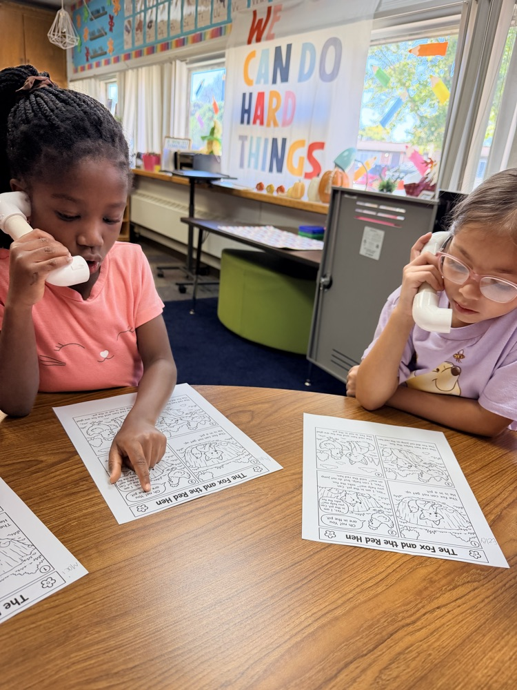 1st graders in Mrs. Younghans IE time talking into “phones” so they can hear their own voice when they read. 