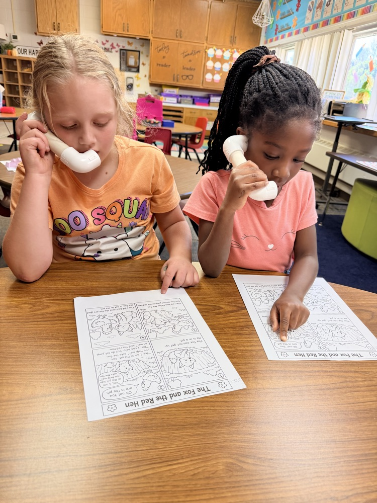 1st graders in Mrs. Younghans IE time talking into “phones” so they can hear their own voice when they read. 