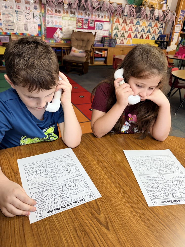 1st graders in Mrs. Younghans IE time talking into “phones” so they can hear their own voice when they read. 