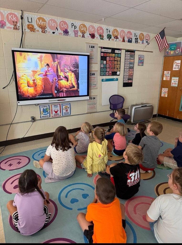 1st graders enjoyed listening to a story.