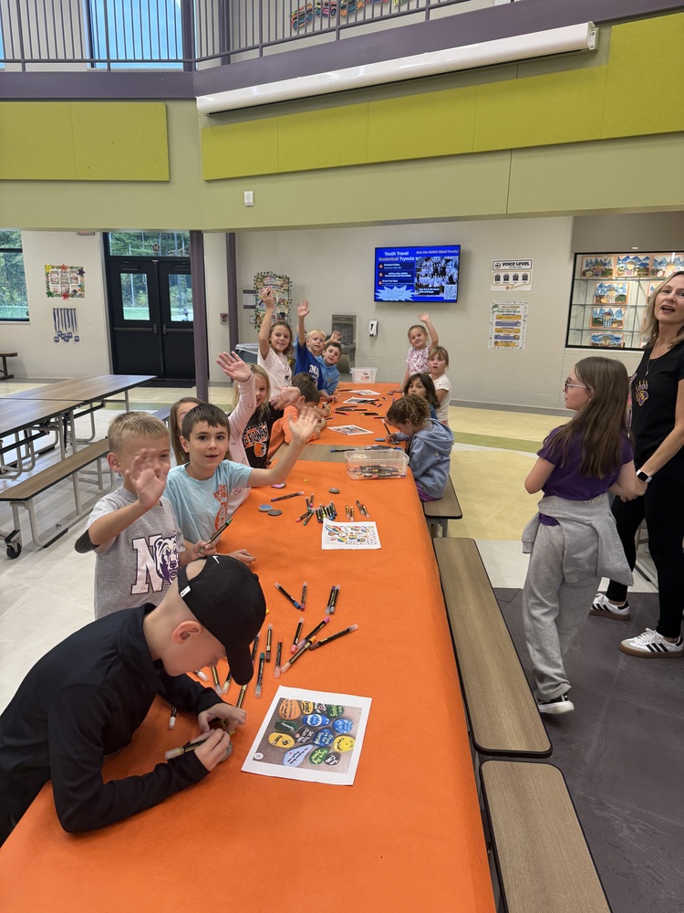 hese are our Hello Buddies (grades 2-4) painting kindness rocks to be placed around our school building.