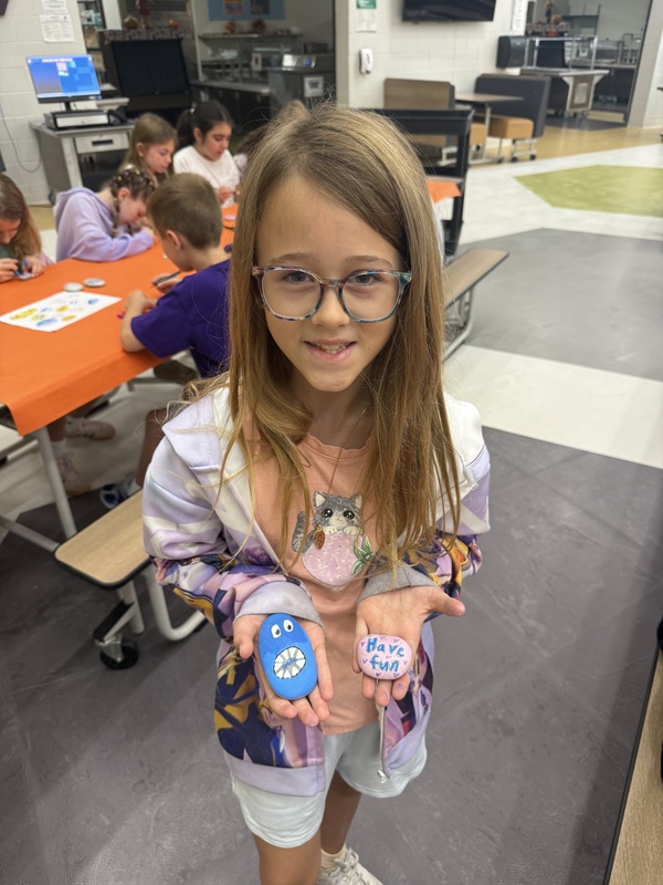 students painting rocks