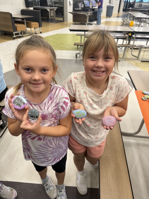 students painting rocks