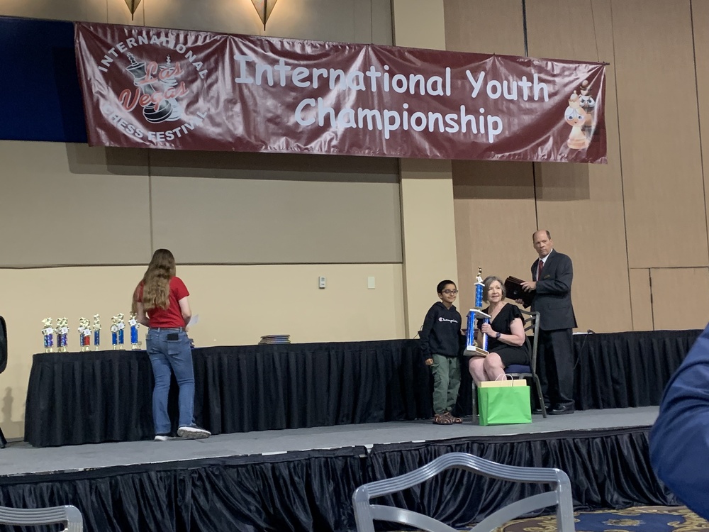 student winning award for chess championship