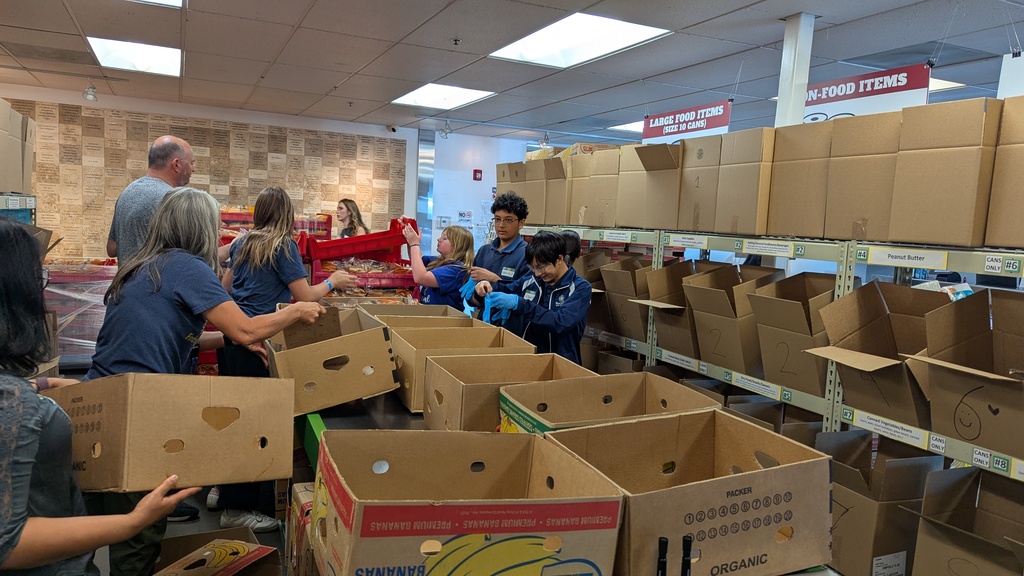 Students and staff helping at The Food Bank