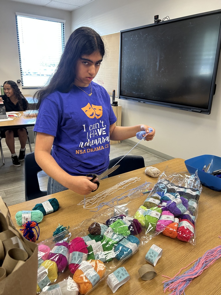 GIrl cutting yarn