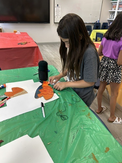 Student creating a fish
