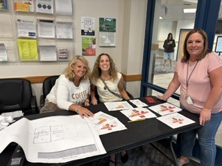 3 staff members at work