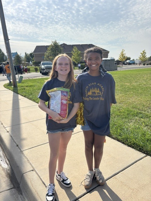 two students on sidewalk