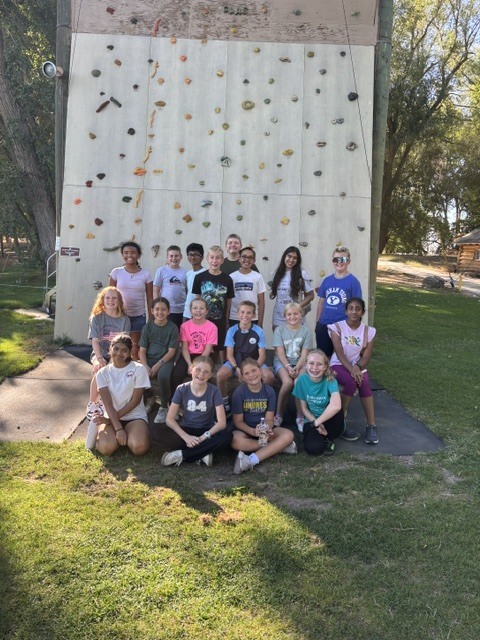 Student Body Officers in front of climbing wall
