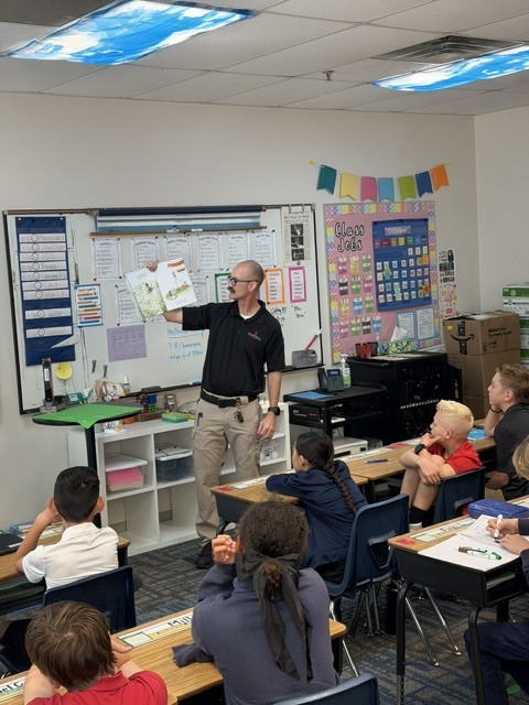Bluffdale Fire reading to 6th graders