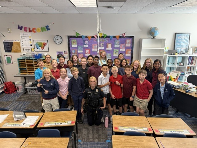 6th grdae class and officer Archer