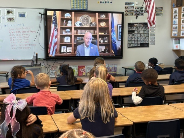 Gov Cox reading to 2nd grade