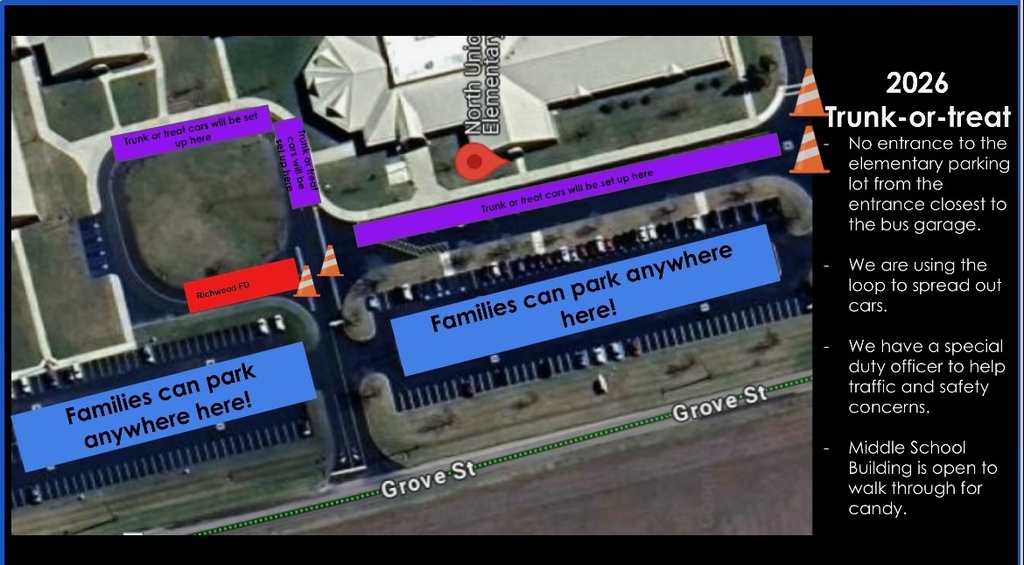 An aerial view of a school parking lot with blue and purple lines marking parking and traffic areas.