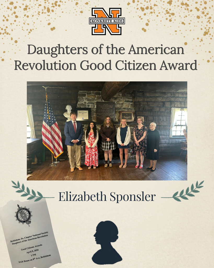 A picture of 5 students and an adult standing in front of a brick fireplace with the American Flag to their right side.