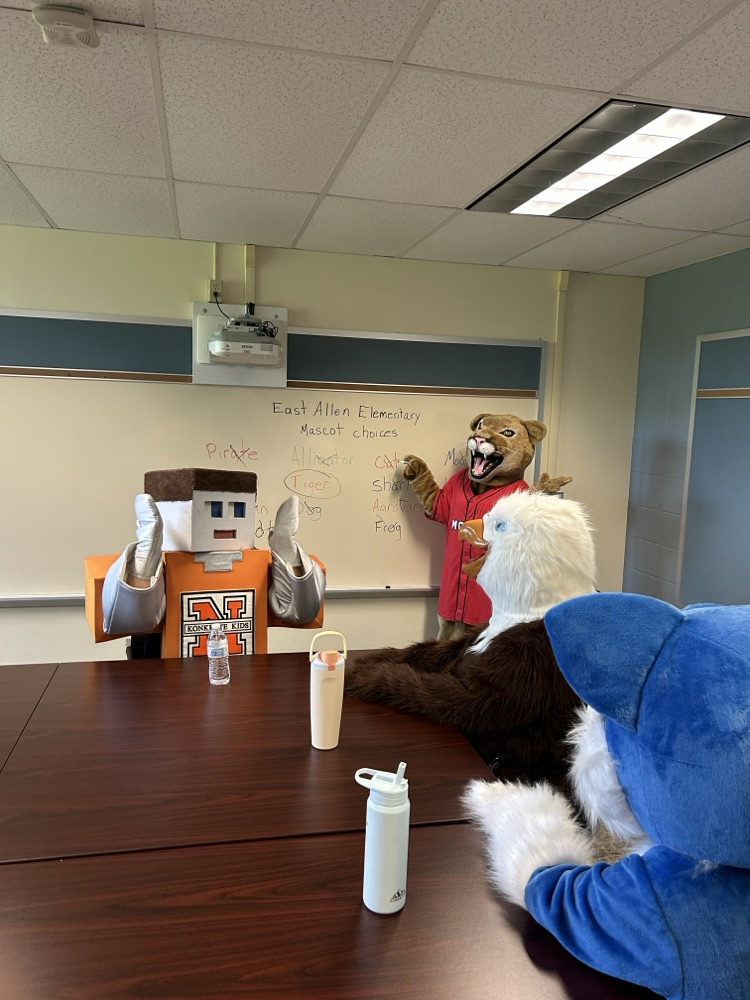 A picture of the NASD Elementary School mascots deciding on the new mascot for East Allen Elementary School