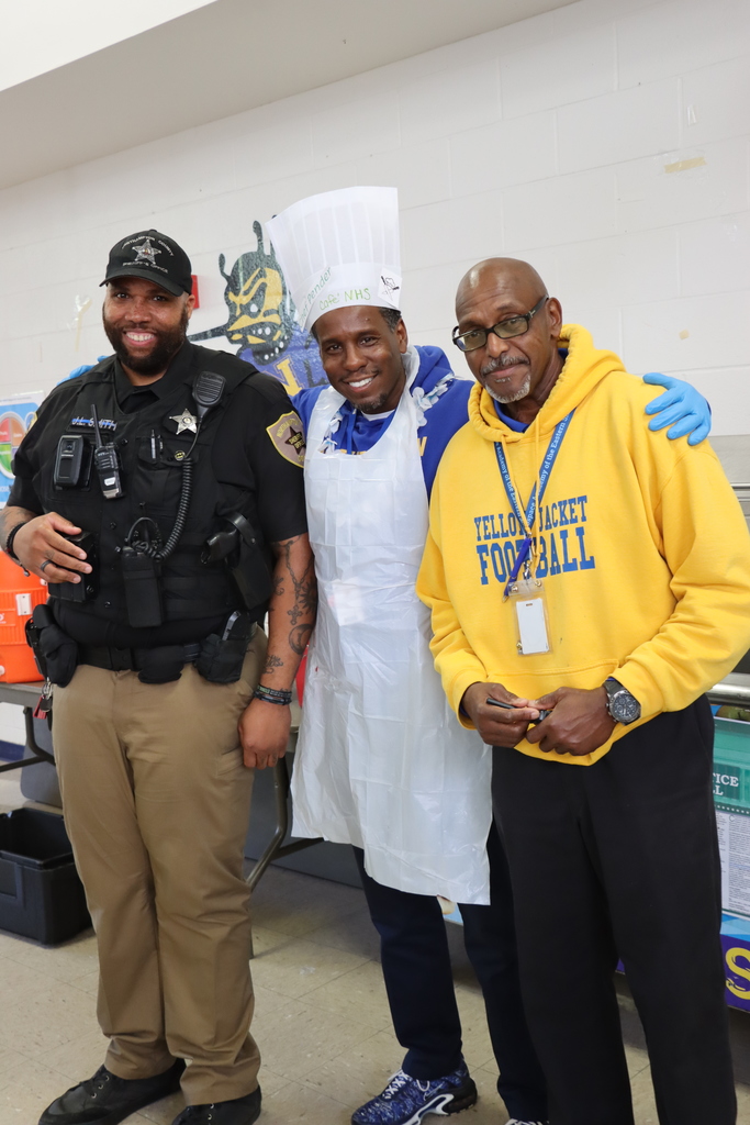 three men posing together